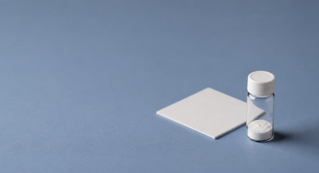 Sample plate and vials on a blue background